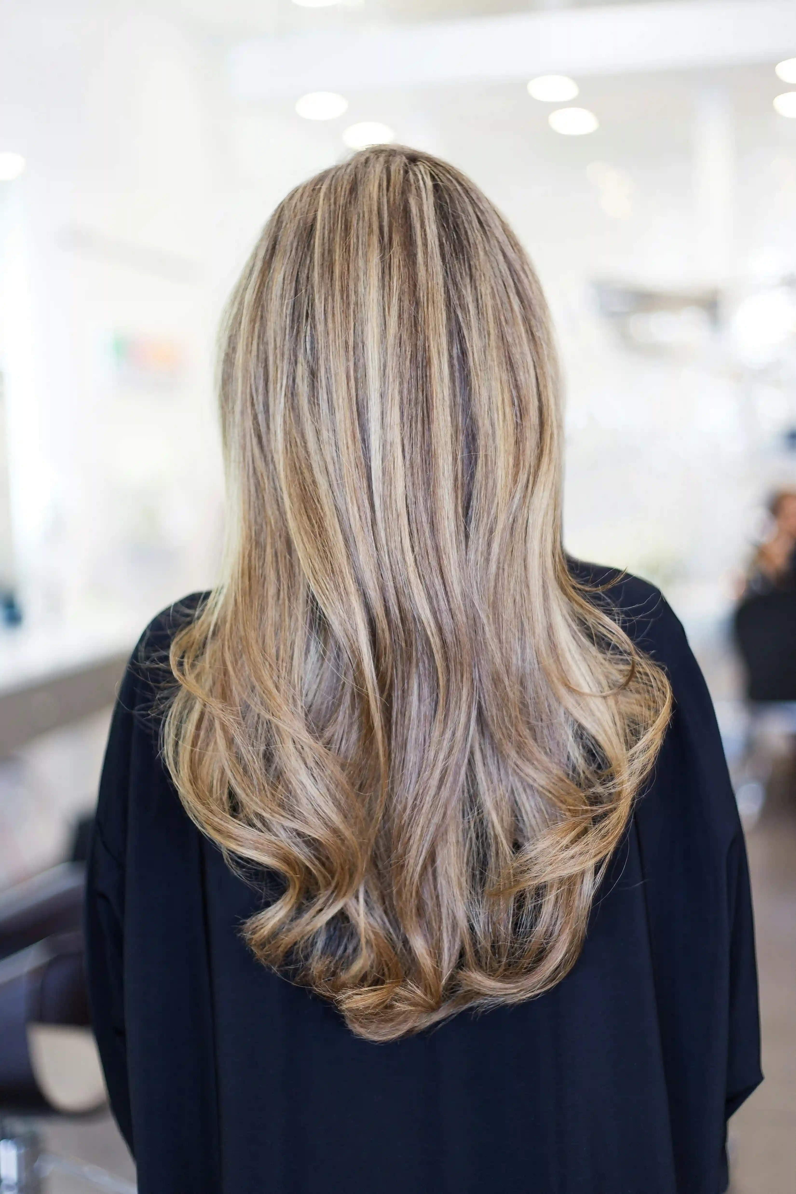 Bride receiving hair coloring highlights