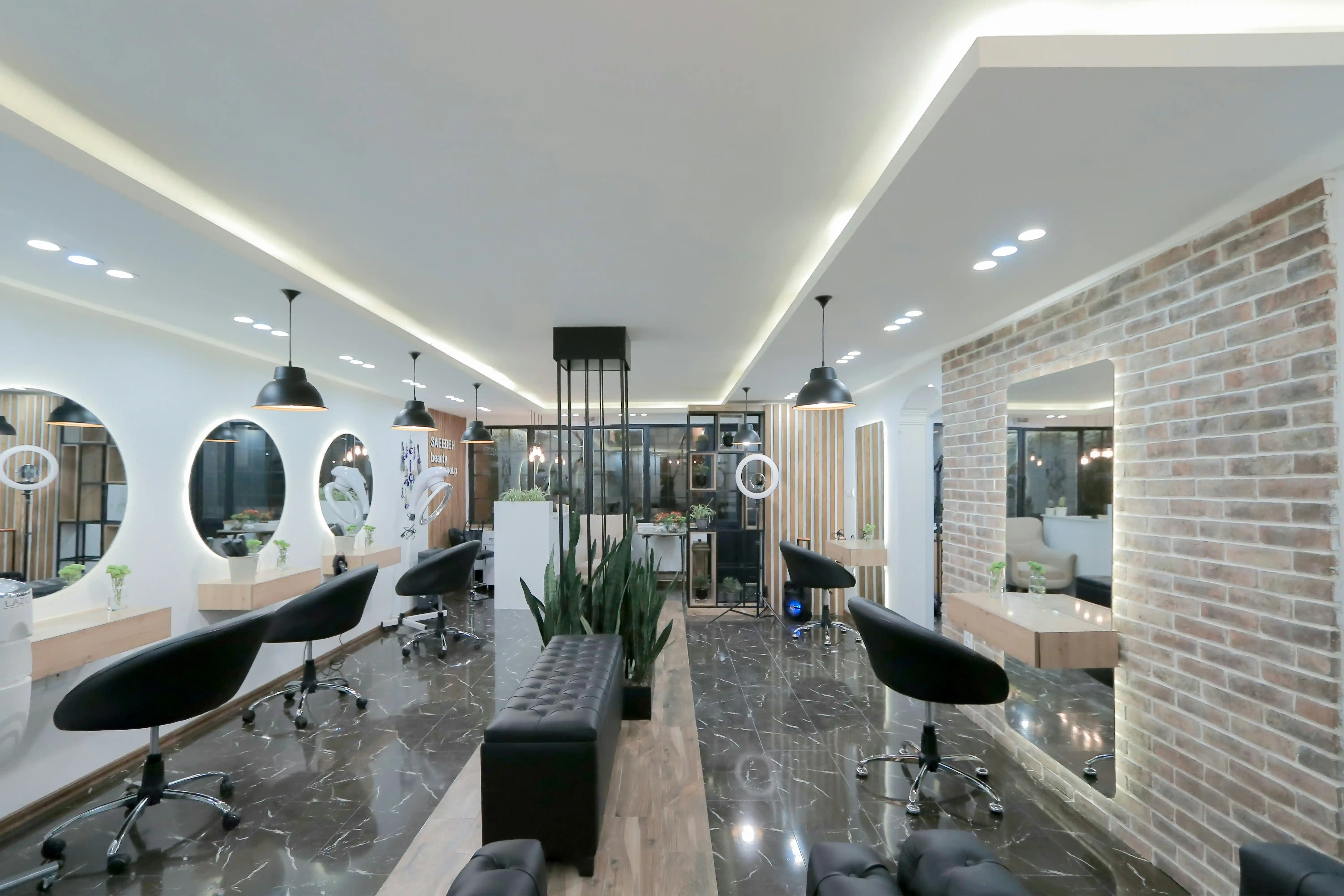 Luxury modern styling stations and vanity mirrors inside Glamour Beauty Parlour