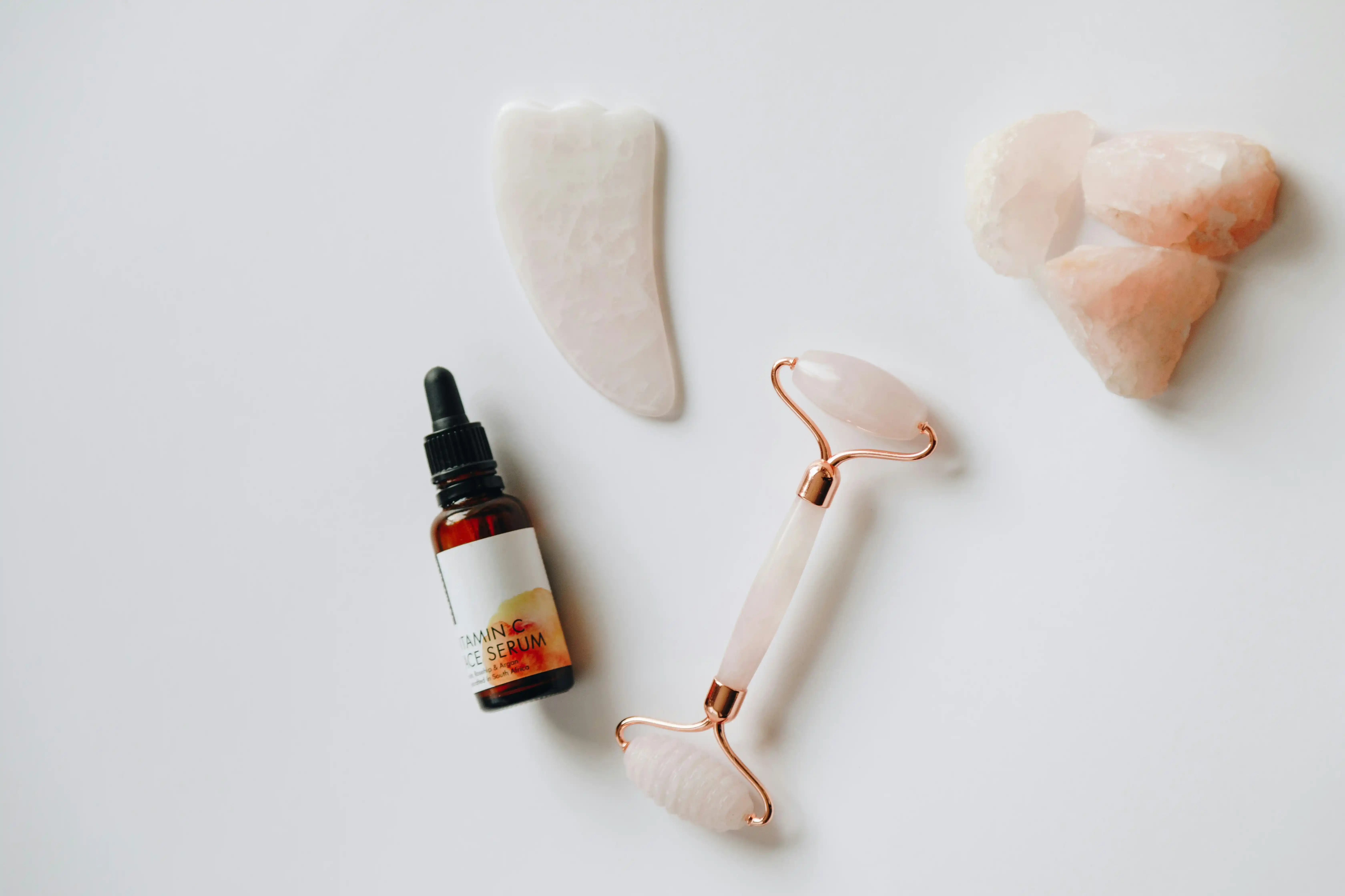 Luxury facial skin treatment with rose quartz roller
