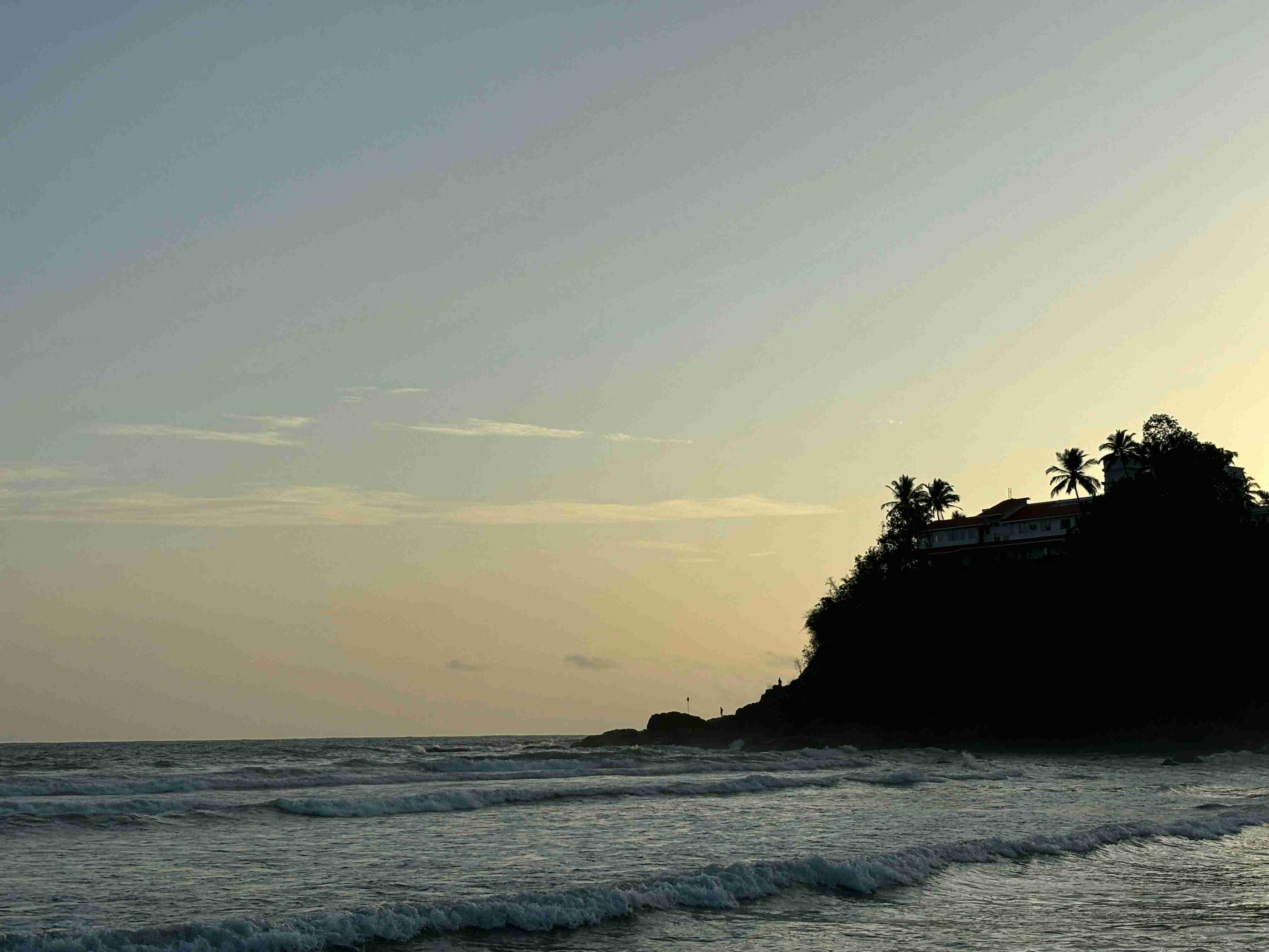 Sunset views over Baga beach shacks and waves