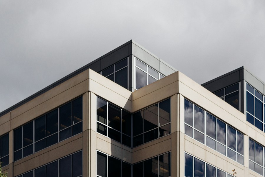 Nexora Business Centre — a modern office building with a stone and glass facade