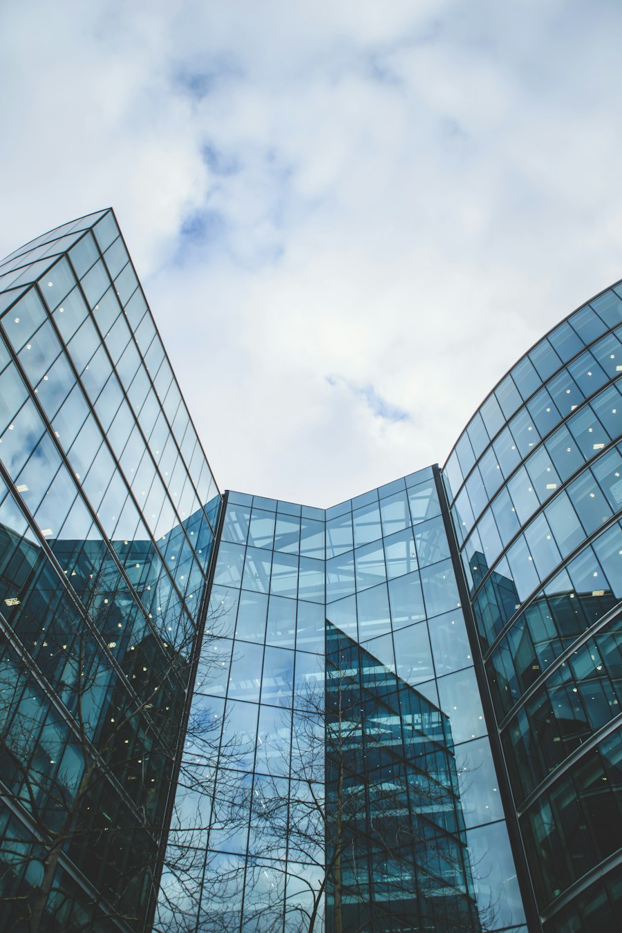 Curved glass curtain-wall facade of a contemporary commercial building